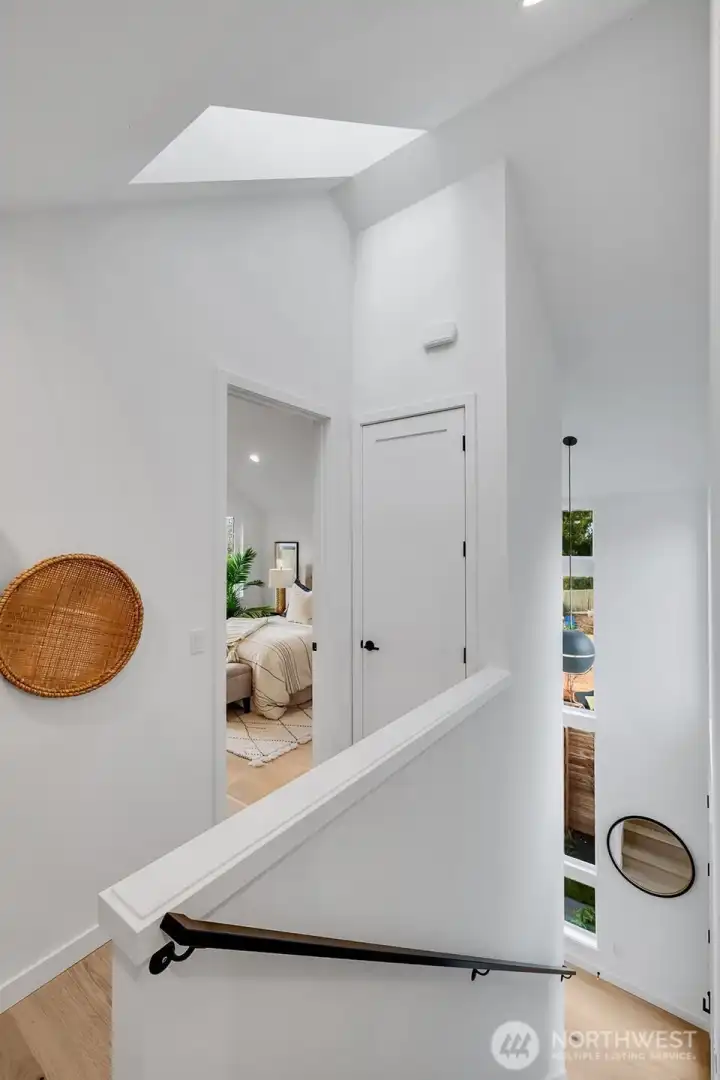 Upper floor top of stairs facing Primary bedroom.