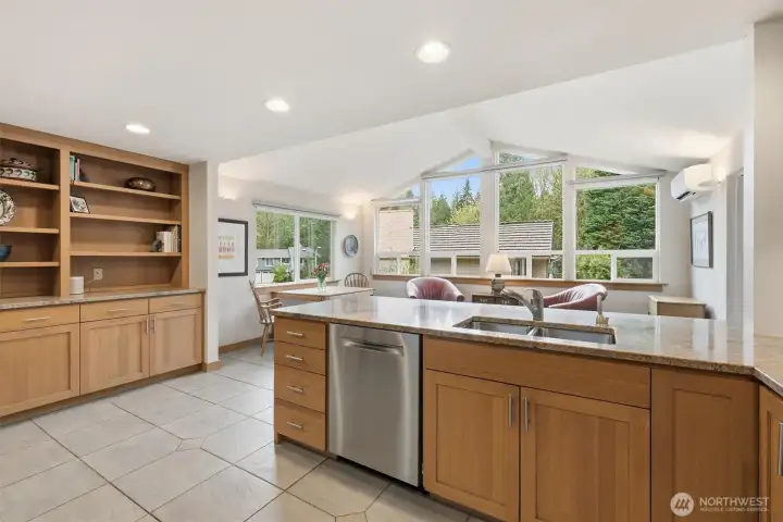 Oversized widows bring in the natural light provided by the ideal Western exposure. All windows in this home have been replaced with high-end vinyl window systems.  You will also enjoy the classic built-ins perfectly situated above fabulous cabinet storage.