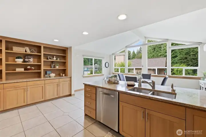 Oversized widows bring in the natural light provided by the ideal Western exposure. All windows in this home have been replaced with high-end vinyl window systems. You will also enjoy the classic built-ins perfectly situated above fabulous cabinet storage. Oversized widows bring in the natural light provided by the ideal Western exposure. All windows in this home have been replaced with high-end vinyl window systems. You will also enjoy the classic built-ins perfectly situated above fabulous cabinet storage.