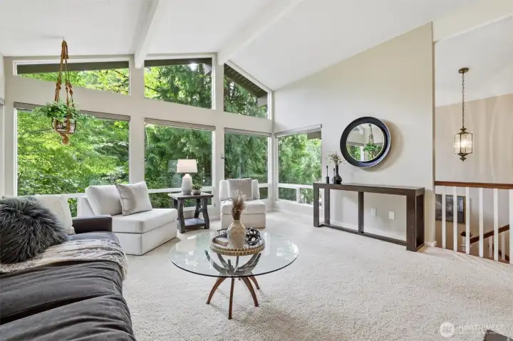 Moving to more formal spaces, here is the formal living room. Vaulted ceilings and yet more oversized windows highlight this private and serene space. Keep this formal or make it the perfect family room with plenty of space for your large furniture. Moving to more formal spaces, here is the formal living room. Vaulted ceilings and yet more oversized windows highlight this private and serene space. Keep this formal or make it the perfect family room with plenty of space for your large furniture.