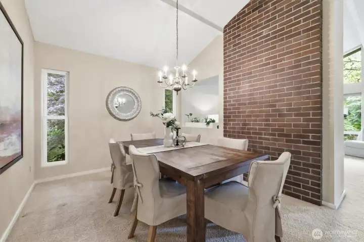 The formal dining room has wonderful angles and is conveniently located adjacent to the kitchen. The formal dining room has wonderful angles and is conveniently located adjacent to the kitchen.