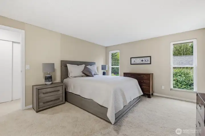 The primary suite has great size and can accommodate large bedroom furniture. You will love this room's privacy.