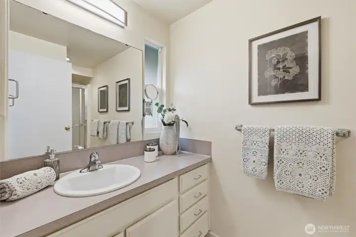 The main bathroom upstairs, like the rest of the home, is clean as a whistle. The main bathroom upstairs, like the rest of the home, is clean as a whistle.