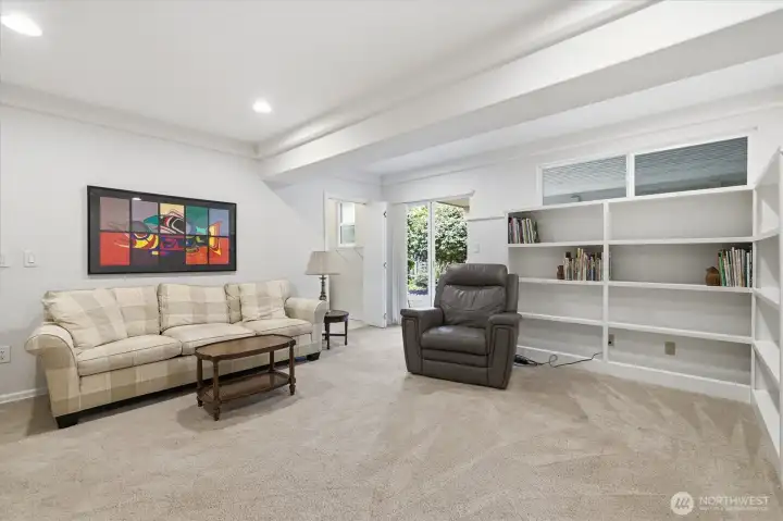 Enjoy the built-in book shelves and convenient access to the back yard.  Also pictured is a door into the adjacent laundry/mud room, the perfect spot to take off your muddy clothes when coming in from outside.