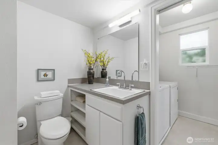 Here is the aforementioned downstairs 3/4 bathroom that also combines with the laundry room.  You will love the convenient, oversized sink.