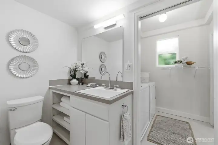 Here is the aforementioned downstairs 3/4 bathroom that also combines with the laundry room. You will love the convenient, oversized sink. Here is the aforementioned downstairs 3/4 bathroom that also combines with the laundry room. You will love the convenient, oversized sink.