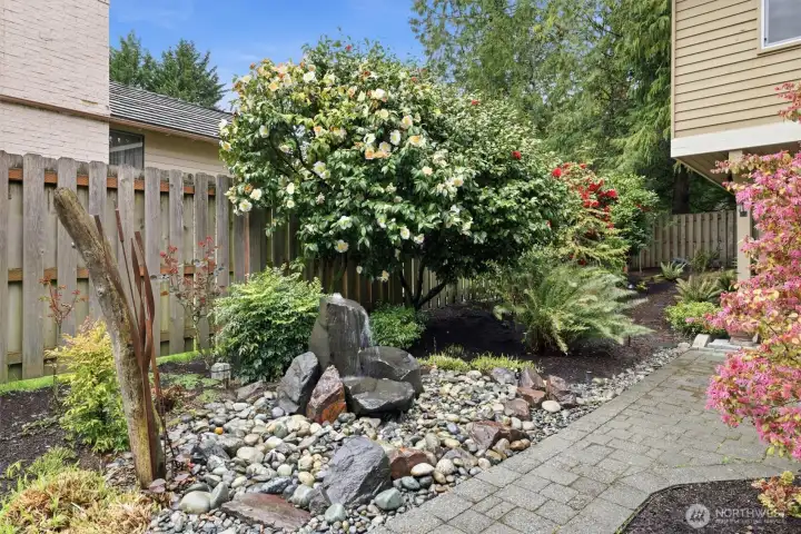 The private yard has been professionally landscaped and beautifully maintained throughout the years.  The water feature is stunning!