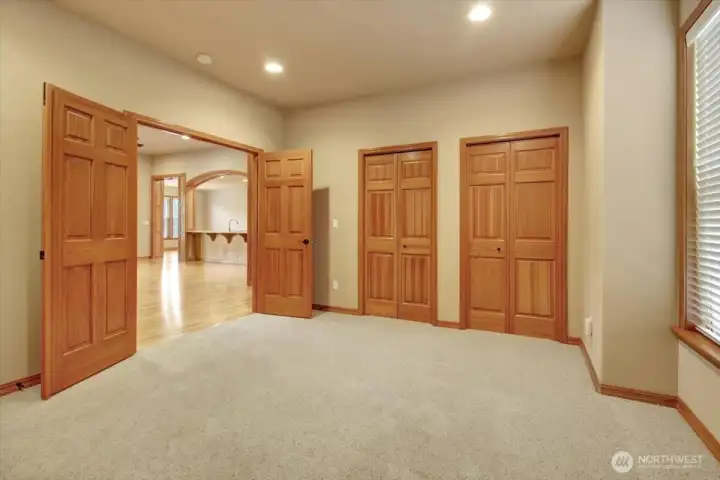 Frent doors to office open to central living area and close to front door.