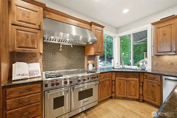 Pasta water tap and Wolf gas range and hood make cooking a joy.