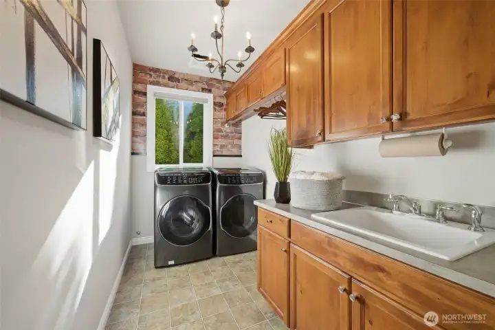 Laundry room w/ large capacity W/D and custom Acorn alderwood cabinets.