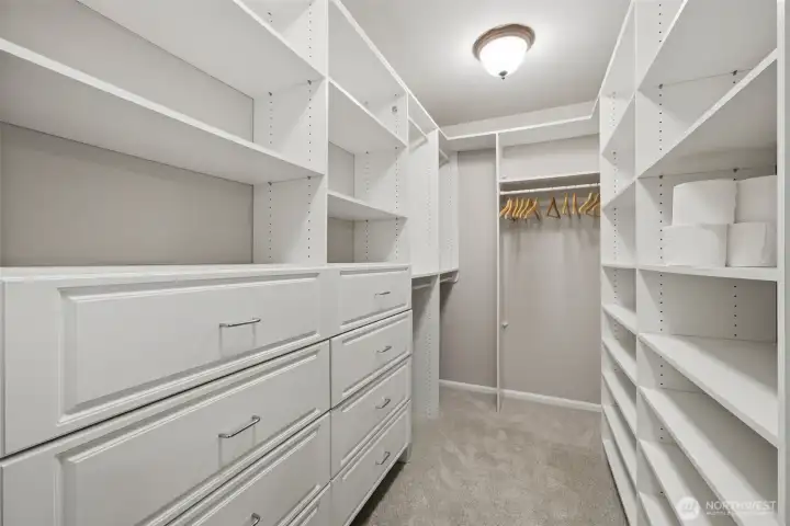 Walk in closet with California Closet built in's.