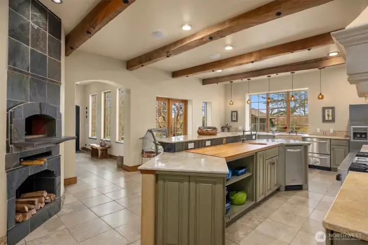 Imported wood fire Italian pizza oven is one of the many appointments in this magnificent kitchen.