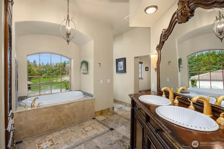 This primary bathroom is like entering your on private spa. Out of view is a large walk in shower.