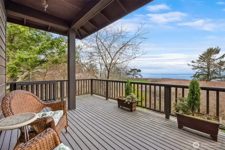 Wonderful views from the covered deck. Exterior stairs create a separate entrance for this wing of the home.