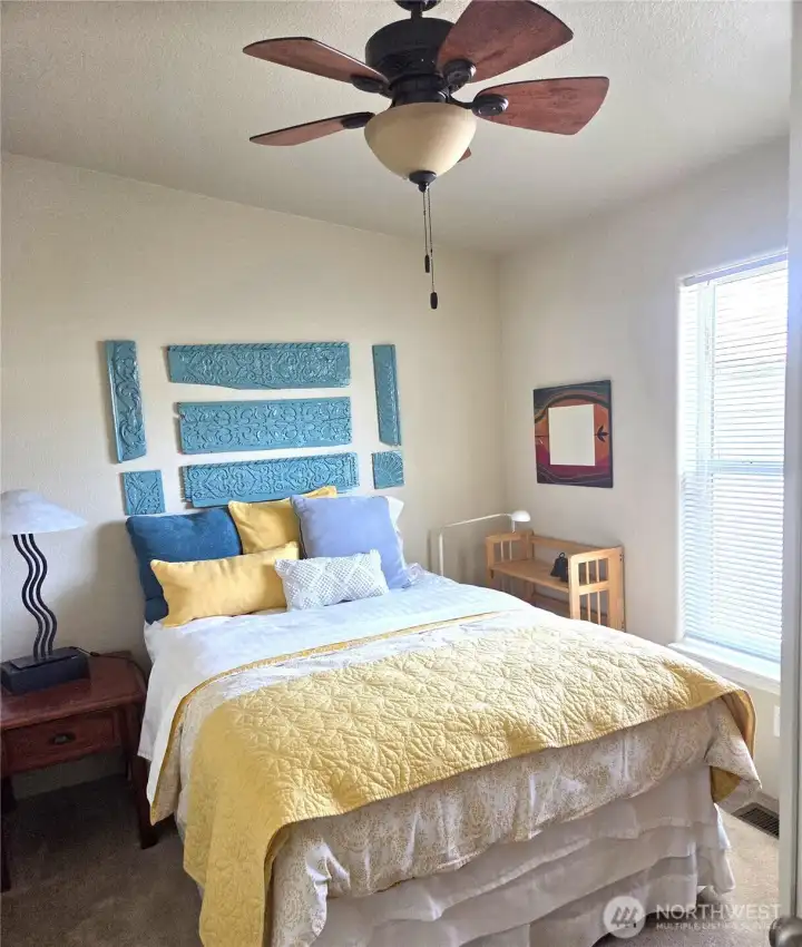 An attractive guest bedroom designed for comfort and privacy, with a convenient opening to the living room that allows it to function equally well as a den. An attractive guest bedroom designed for comfort and privacy, with a convenient opening to the living room that allows it to function equally well as a den.
