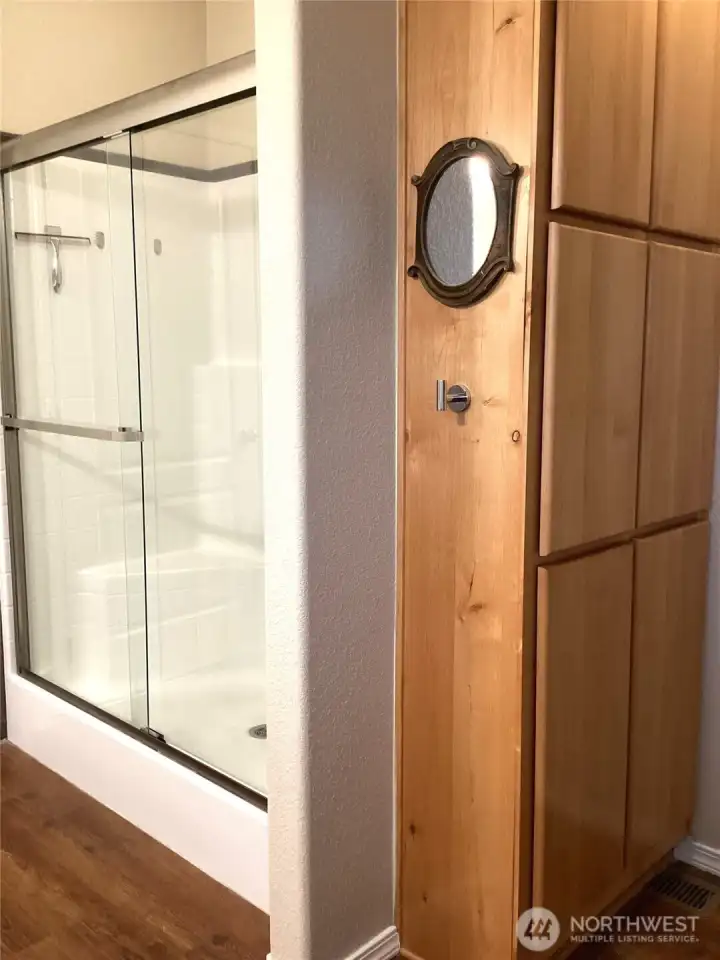 Walk-in shower and convenient storage are additional features of primary bath. Walk-in shower and convenient storage are additional features of primary bath.