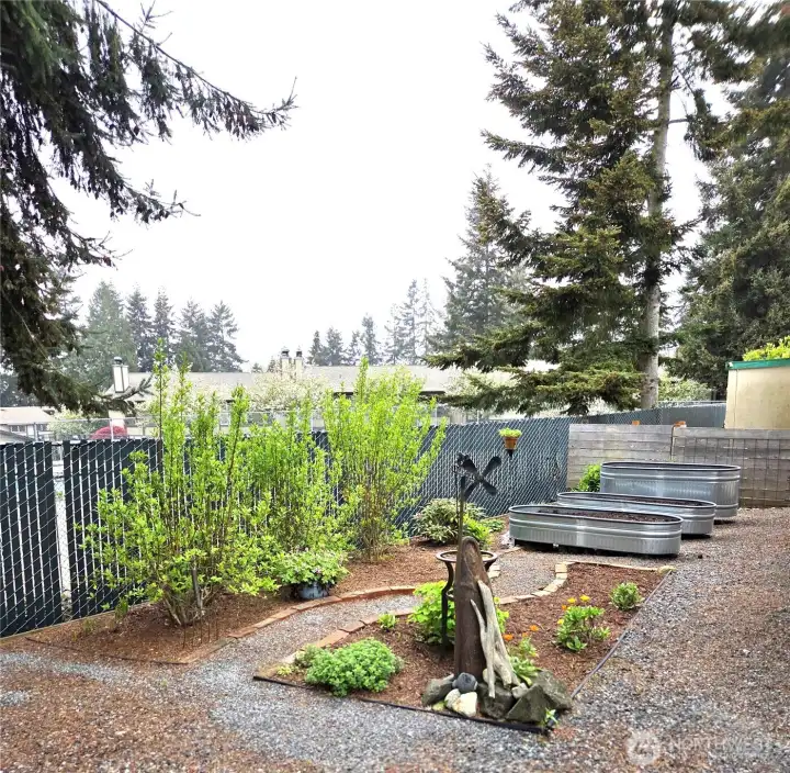 A gardener’s delight featuring three planting tubs prepped and ready for your choice of vegetables or flowers.