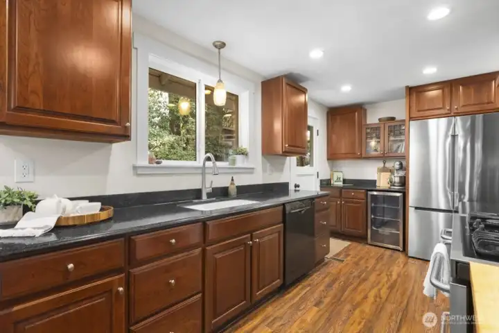 There’s plenty of counter space here and one set of glass-front upper cabinets to display favorite treasures.