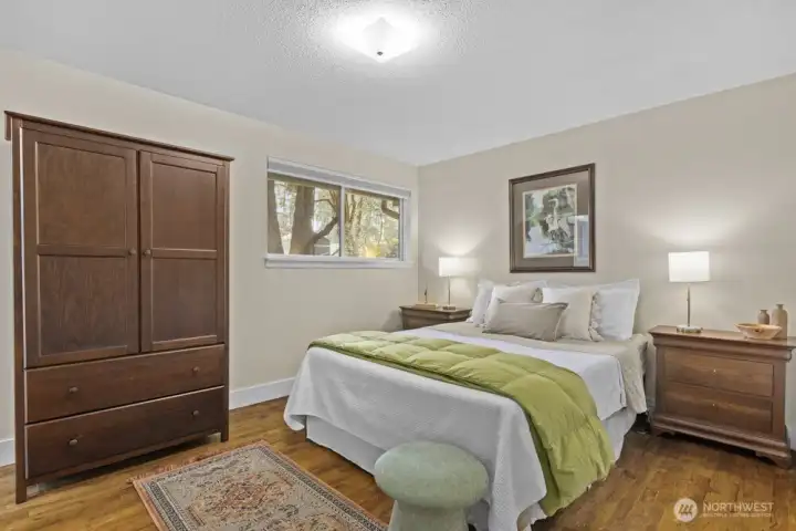 The primary bedroom is tucked in at the end of the hallway with an east facing window.