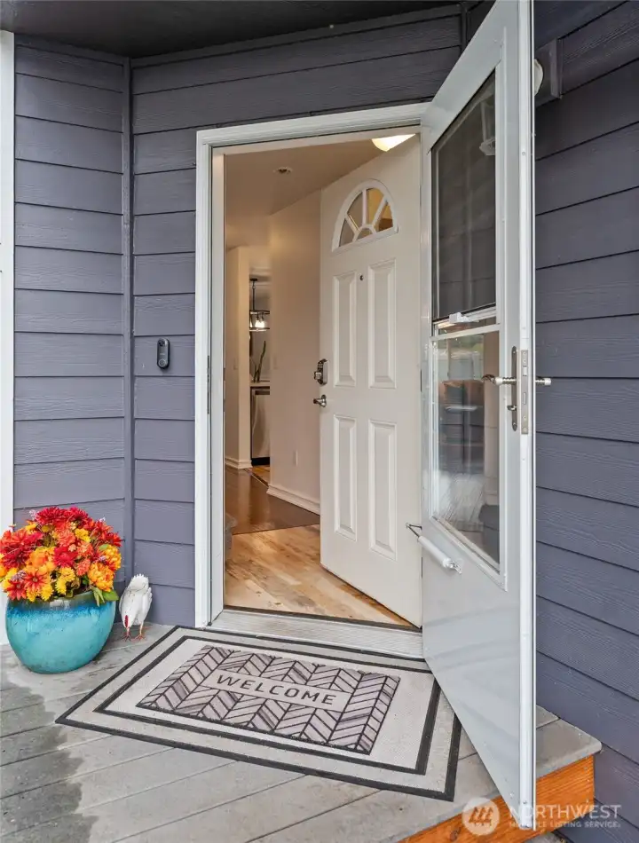 Welcome home—covered front porch and a spot that feels tucked away yet connected