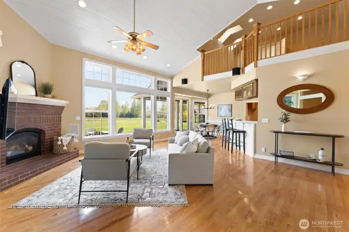 Living room with surround sound looking towards the dining room and kitchen.  Notice the loft above.