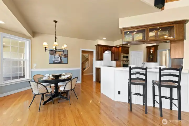 Spacious dining room and kitchen with breakfast bar.