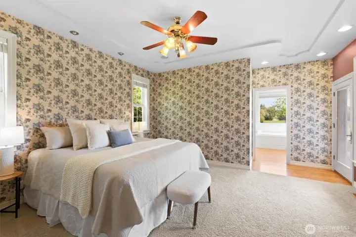 Primary en suite.  Plenty of room for a king sized bed.  Access onto the back patio.
