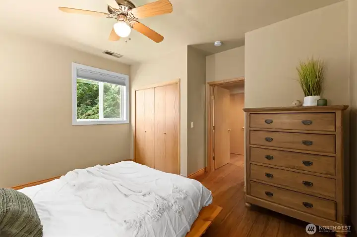 Detached ADU bedroom with high quality Casablanca ceiling fan. Bathroom door is opposite the bedroom door.