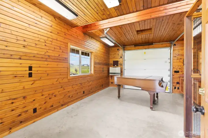 The studio! What use could you dream up for this 400 sq ft outbuilding with cedar interior? It is insulated, heated and plumbed with a kitchen sink and cabinet storage. It is wired for internet. Truly a flexible space!