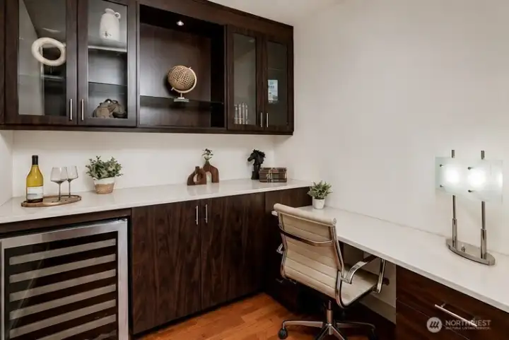 Den with built-in's and wine fridge