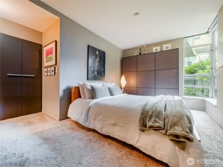 European sophistication meets smart storage in this flawless, designer-grade primary suite retreat.