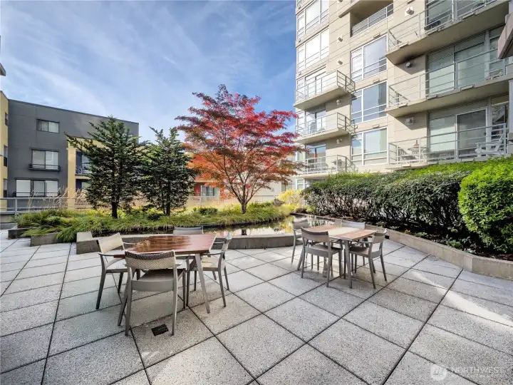 Your unit faces this serene private terrace — tranquil, green, and completely shielded from street noise.