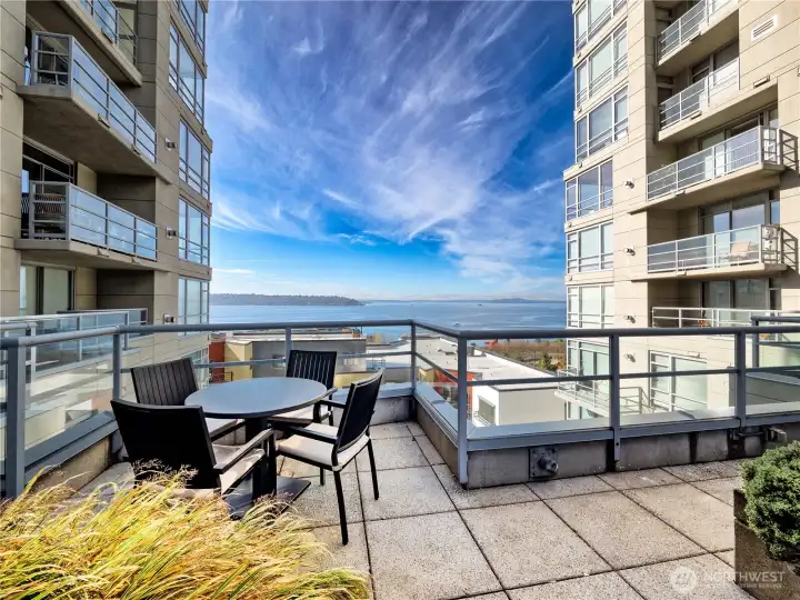 Elevated luxury living with exclusive access to a breathtaking 6th-floor terrace overlooking Elliott Bay and the Olympic Mountains