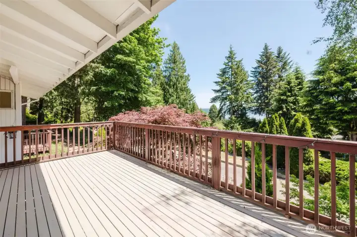 Front deck overlooking Dyes Inlet with views of Mount Rainier on clear days. Surrounded by mature landscaping and towering evergreens, this peaceful outdoor space is perfect for relaxing or entertaining year-round. Front deck overlooking Dyes Inlet with views of Mount Rainier on clear days. Surrounded by mature landscaping and towering evergreens, this peaceful outdoor space is perfect for relaxing or entertaining year-round.