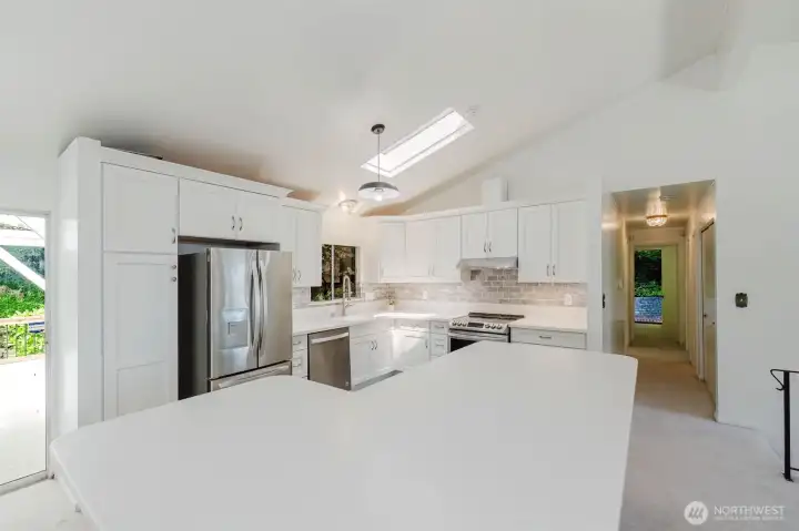 Stylish and move-in ready kitchen featuring sleek stainless steel appliances installed in 2023, a sought-after double oven, and an eye-catching tile backsplash that ties the space together beautifully. Stylish and move-in ready kitchen featuring sleek stainless steel appliances installed in 2023, a sought-after double oven, and an eye-catching tile backsplash that ties the space together beautifully.