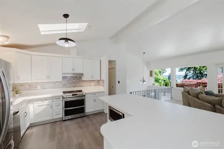 The skylight fills the space with natural light, while the nearby water views add a peaceful backdrop to everyday living and entertaining. The skylight fills the space with natural light, while the nearby water views add a peaceful backdrop to everyday living and entertaining.