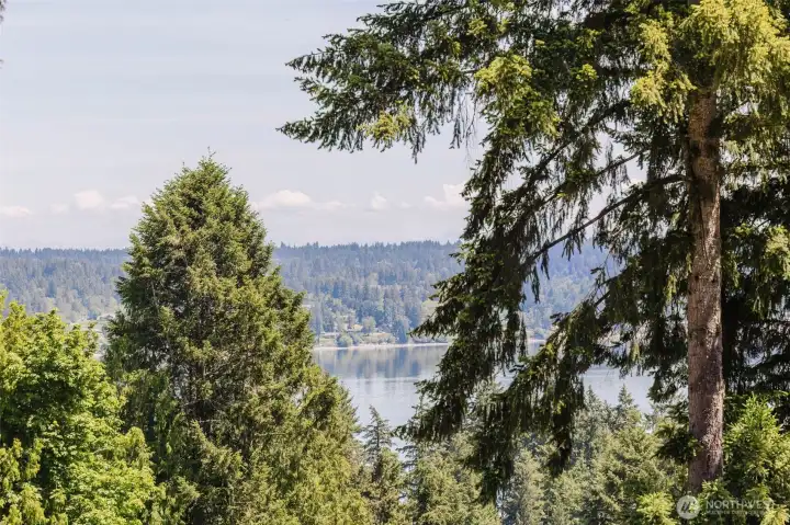 Enjoy peaceful water views from the upper lot, where the natural surroundings create a serene, private setting that feels miles away while still being conveniently close to town. Enjoy peaceful water views from the upper lot, where the natural surroundings create a serene, private setting that feels miles away while still being conveniently close to town.