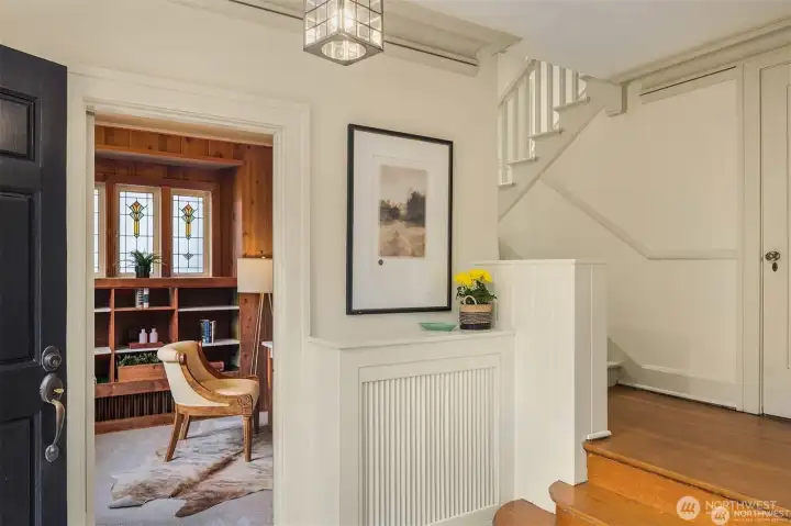 Formal front entry leads to a office or den with traditional stained glass windows on the main floor. Formal front entry leads to a office or den with traditional stained glass windows on the main floor.