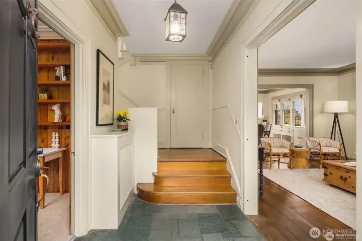 Slate entry with hardwood stairs lead gracefully up to the four bedrooms. Slate entry with hardwood stairs lead gracefully up to the four bedrooms.