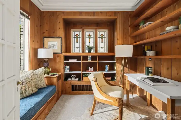 Den, library or office right off the main entry has classic details and stained glass windows. Den, library or office right off the main entry has classic details and stained glass windows.