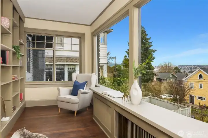 Library and sitting room on main floor with oversized windows and plenty of light. Library and sitting room on main floor with oversized windows and plenty of light.