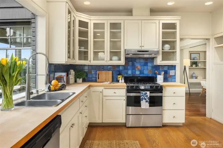 built in cabinets throughout kitchen and gas range. built in cabinets throughout kitchen and gas range.