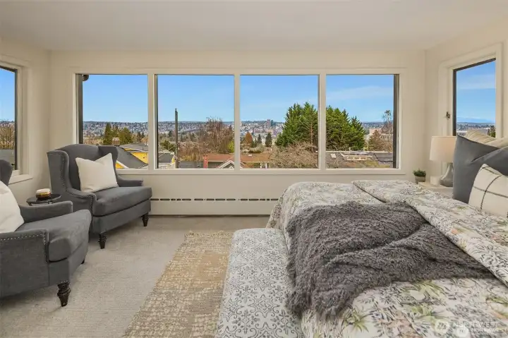 Mountain views from primary bedroom with seating area. Mountain views from primary bedroom with seating area.