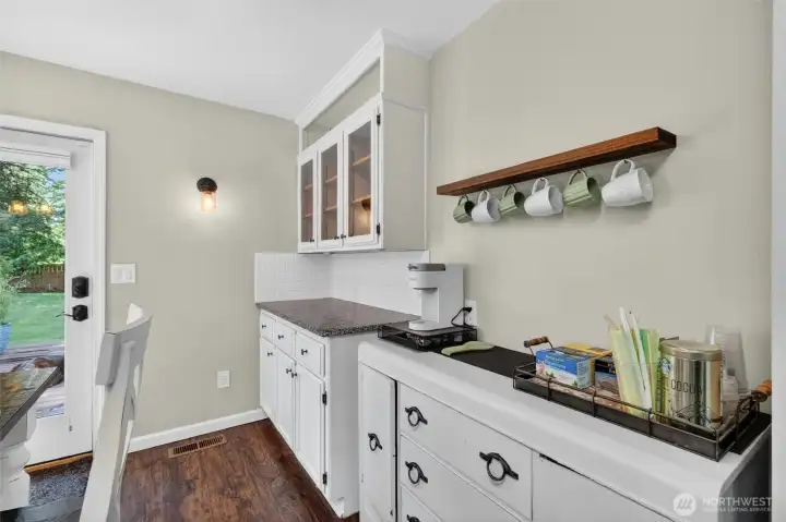 Built-in cabinetry with coffee bar.