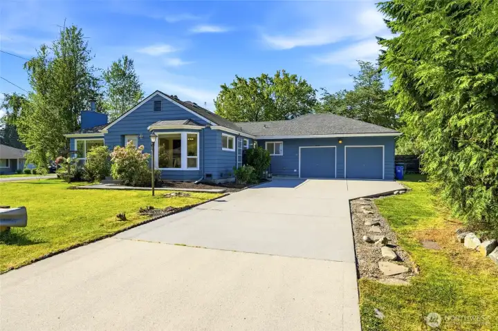 Welcome home to this charming rambler on an almost 11,000 SF Lot