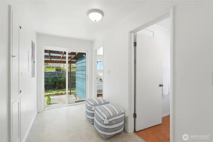 Hallway to back bedroom, bathroom w/laundry and pation access