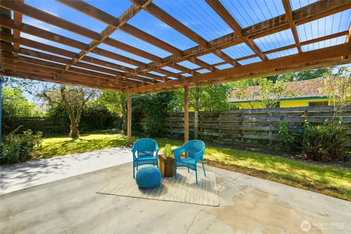 Covered patio with fenced in back yard is great for entertaining