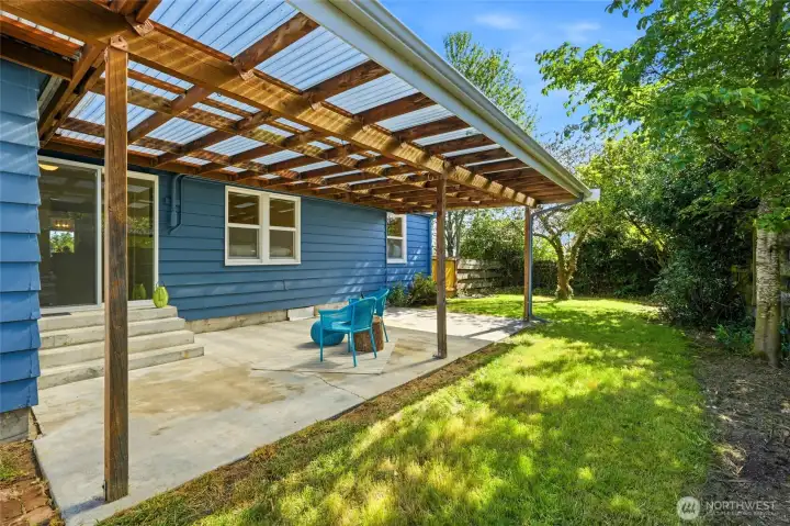 Covered patio with fenced in back yard is great for entertaining