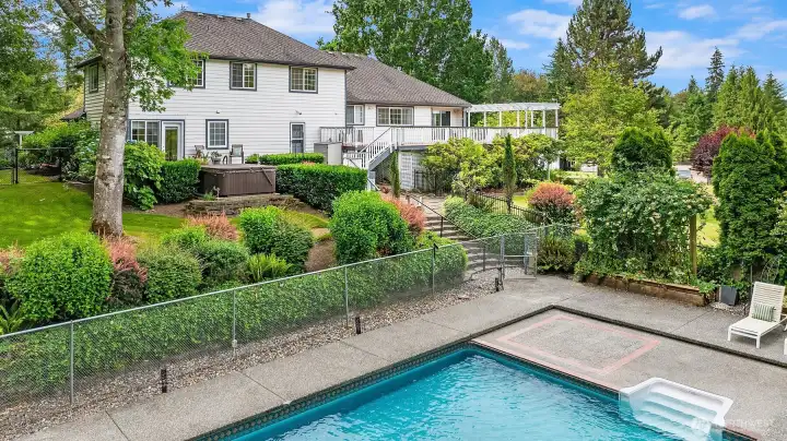 Another view of the home's resort style backyard, where a refreshing swim in the pool can be followed by a relaxing soak in the hot tub. Another view of the home's resort style backyard, where a refreshing swim in the pool can be followed by a relaxing soak in the hot tub.