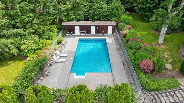 Designed for both peaceful afternoons and lively entertaining, the sparkling pool serves as the centerpiece of this private outdoor retreat. Designed for both peaceful afternoons and lively entertaining, the sparkling pool serves as the centerpiece of this private outdoor retreat.